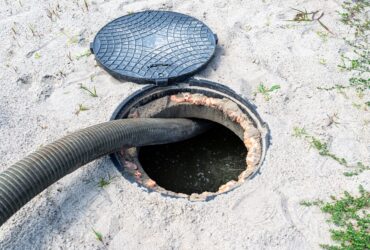 A,Four-inch,Suction,Pipe,Inserted,Into,A,Home,Septic,Tank, A,Four-inch,Suction,Pipe,Inserted,Into,A,Home,Septic,Tank,