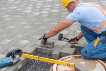 Laying,Interlocking,Paving.,A,Worker,Is,Placing,Interlocking,Paving,Stones Laying,Interlocking,Paving.,A,Worker,Is,Placing,Interlocking,Paving,Stones
